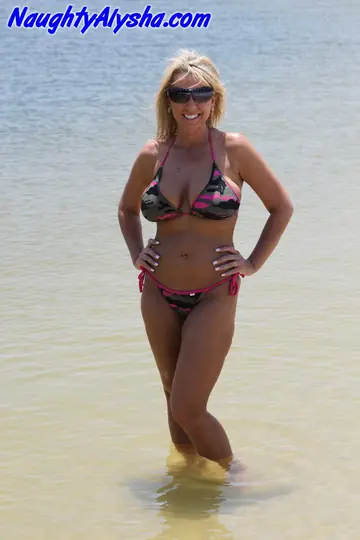 Busty Blonde Masturbates with a Dildo on the Beach
