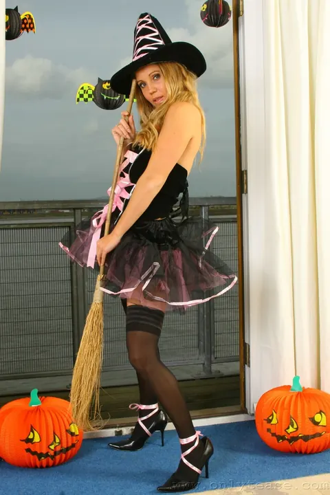 Busty Woman Teases in Witch Costume and Black Stockings – photo 2 of 21