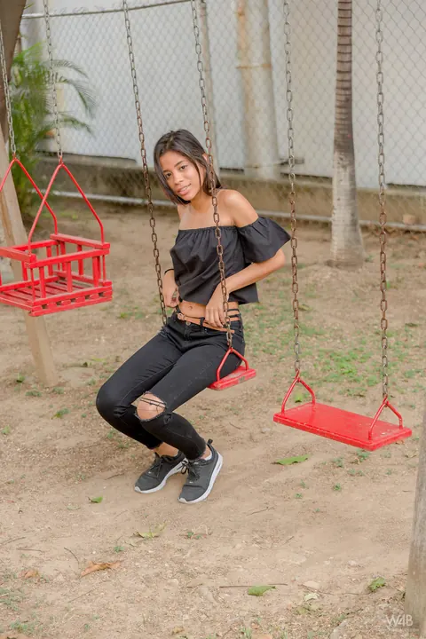 Karin Torres: Latina Brunette Sits on a Swing in Ripped Jeans – photo 15 of 16
