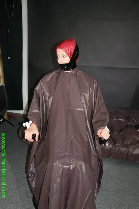 Amateur Bound and Gagged in Raincoat and Socks on a Chair – photo 15 of 16