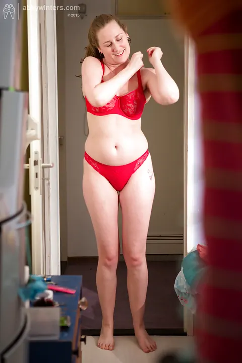 Busty Redhead in Lingerie and Shorts Adjusts Panties – photo 7 of 16