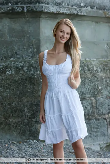 European Blonde Strips Out of Her Dress Outdoors