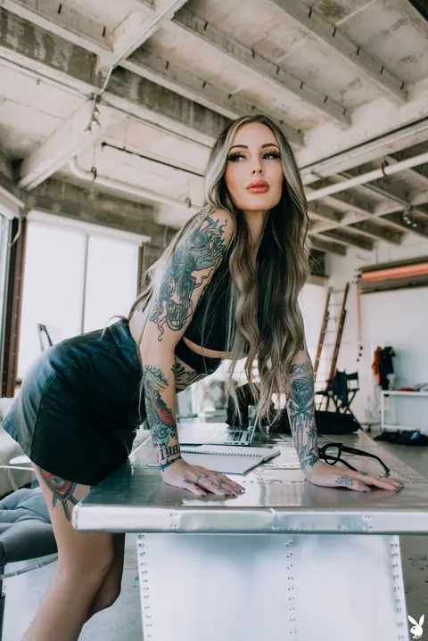 Tattooed Woman in Glasses Strips and Spreads Outdoors – photo 2 of 20