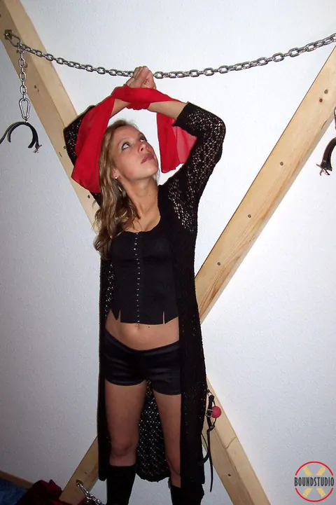 Blonde Bound to a Cross in Shorts and Boots – photo 4 of 16