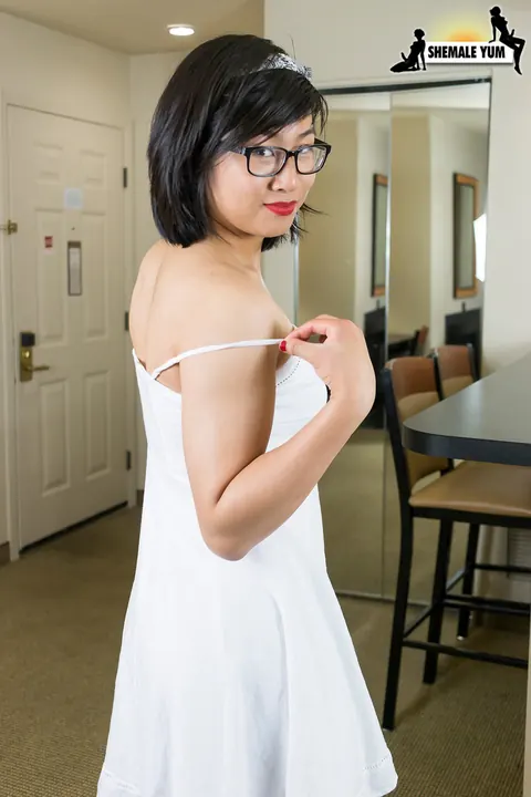 Asian Trans Woman Lets Dress Fall and Stands Nude – photo 5 of 16