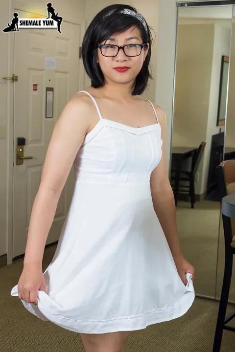 Asian Trans Woman Lets Dress Fall and Stands Nude – photo 4 of 16