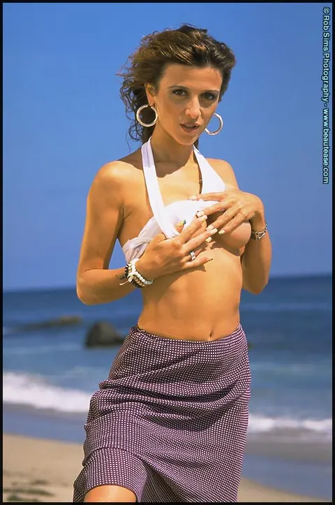 Maeva Exel: Brunette MILF Bares Her Enhanced Tits and Spreads Her Pussy on the Beach – photo 4 of 15