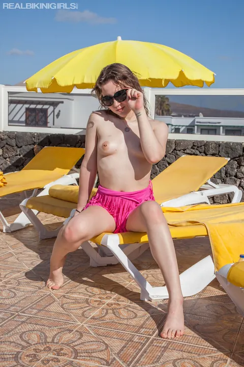 Woman in a Bikini and Glasses Shows Her Small Tits on the Beach – photo 11 of 12