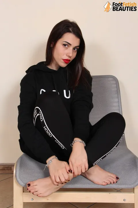 European Brunette Purses Her Red Lips and Removes Her High Heels – photo 10 of 12