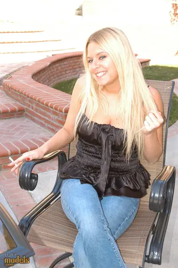Busty Blonde Smokes in a Bikini and Skirt Outdoors