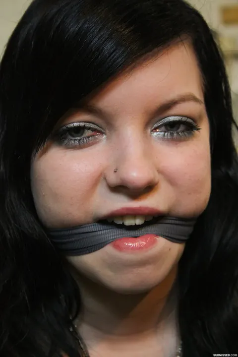 Black-Haired Woman Bound, Gagged and Spread on a Chair – photo 13 of 17