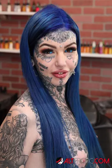 Heavily Tattooed Blonde Spreads Her Shaved Pussy