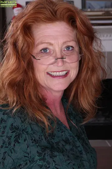 Mature British Redhead Spreads Her Pussy at the Desk