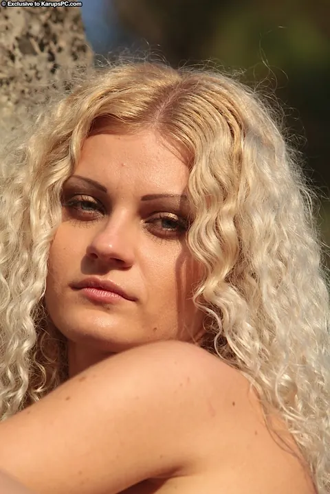 Hairy Blonde Woman Strips Nude and Spreads by a Boulder – photo 10 of 15
