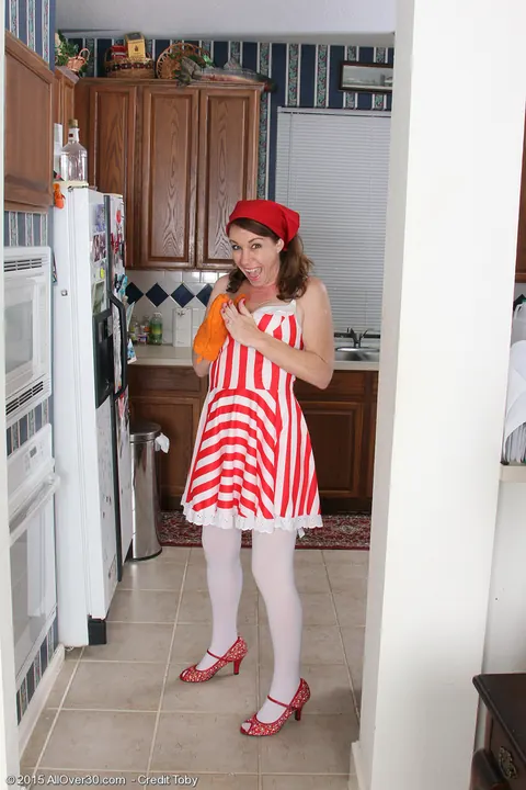 Molly Golly: Mature Brunette MILF Rides a Dildo in Stockings and Uniform in the Kitchen – photo 2 of 16