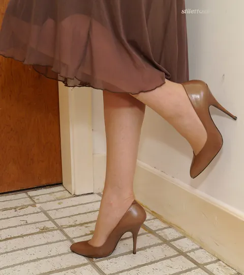 Mature Blonde Flashes Stocking Tops in a Skirt and Heels – photo 7 of 16