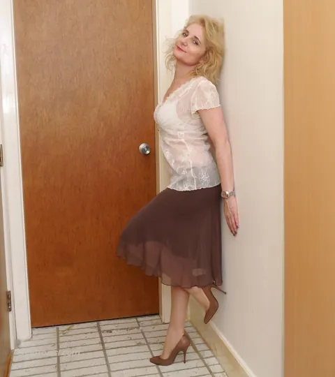 Mature Blonde Flashes Stocking Tops in a Skirt and Heels – photo 8 of 16