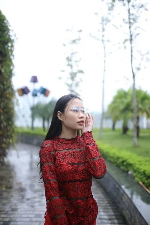 Asian Brunette Poses in Glasses Outdoors in a Public Place – photo 14 of 21