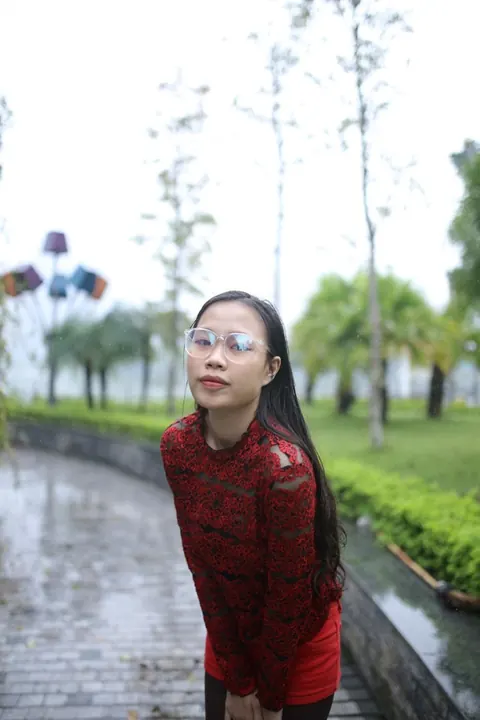 Asian Brunette Poses in Glasses Outdoors in a Public Place – photo 7 of 21