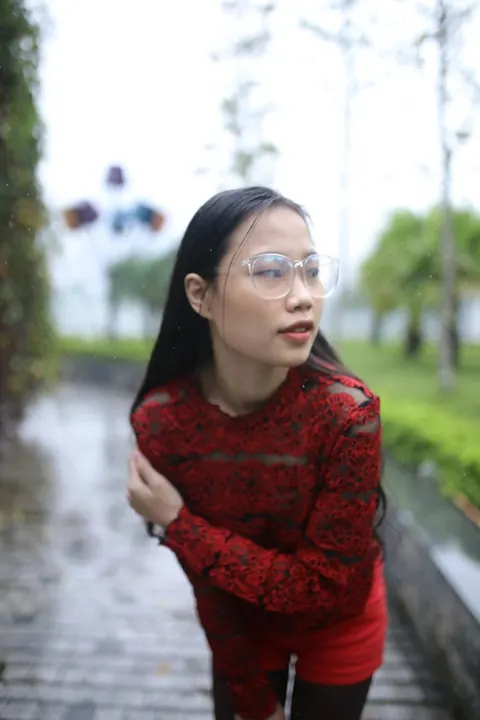 Asian Brunette Poses in Glasses Outdoors in a Public Place – photo 2 of 21