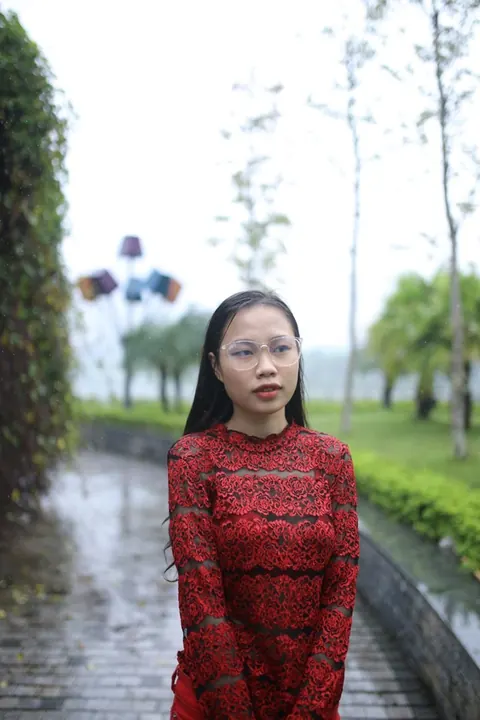 Asian Brunette Poses in Glasses Outdoors in a Public Place – photo 15 of 21