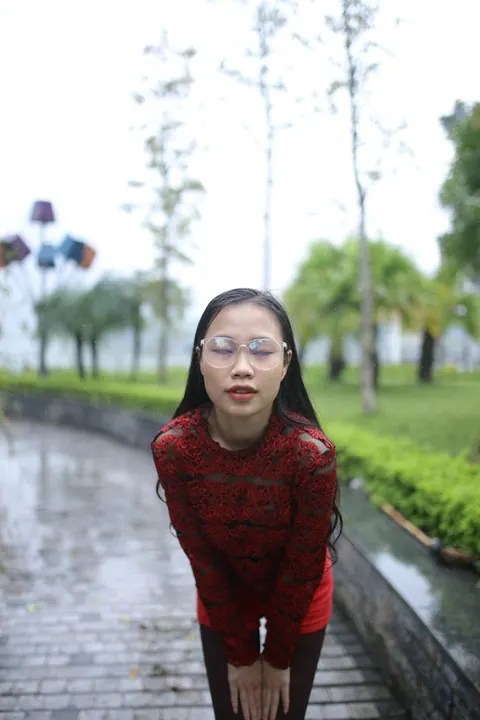 Asian Brunette Poses in Glasses Outdoors in a Public Place – photo 5 of 21
