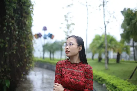 Asian Brunette Poses in Glasses Outdoors in a Public Place – photo 11 of 21