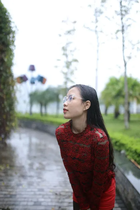 Asian Brunette Poses in Glasses Outdoors in a Public Place – photo 8 of 21