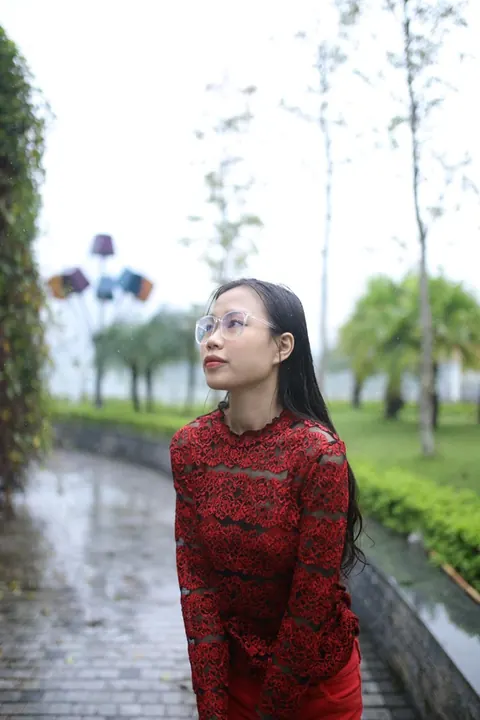 Asian Brunette Poses in Glasses Outdoors in a Public Place – photo 9 of 21