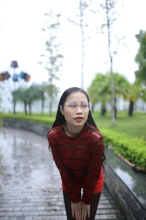 Asian Brunette Poses in Glasses Outdoors in a Public Place – photo 4 of 21
