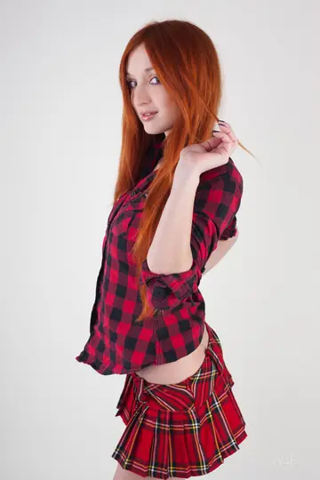 European Redhead Flaunts Her Big Natural Tits on a Chair