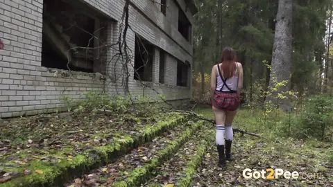 Woman in Boots Pulls Panties Aside to Pee Outdoors – photo 15 of 15