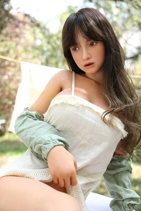 Asian Woman with Enhanced Tits Bares Her Body and Poses – photo 14 of 17