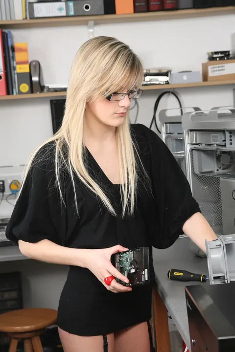 European Blonde in Glasses and Stockings Strips at Computer – photo 4 of 16