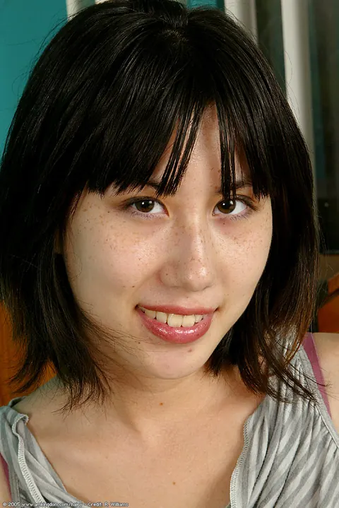 Tall Asian Woman Pulls Panties Aside to Spread Her Hairy Pussy in Socks – photo 1 of 16