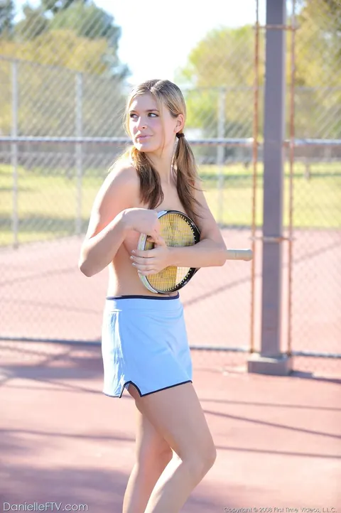 Busty Woman Strips Out of Her Tennis Uniform Outdoors – photo 14 of 21