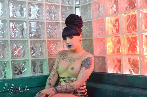 Tattooed Trans Woman Oils Her Body in a Bikini – photo 8 of 16