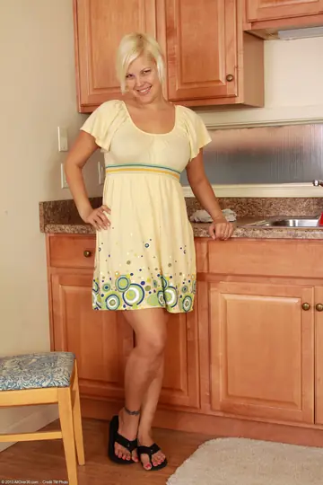 Short-Haired Blonde MILF Strips Nude and Spreads Wide