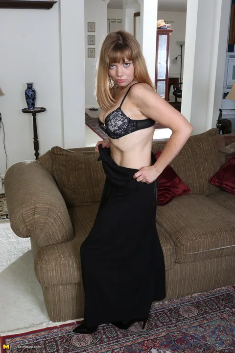 Christy James: Redhead MILF Shows Off Her Black Stockings in the Living Room – photo 9 of 16