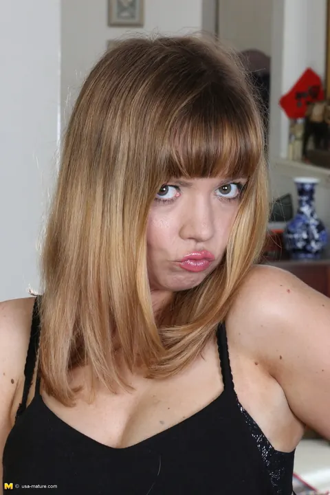 Christy James: Redhead MILF Shows Off Her Black Stockings in the Living Room – photo 6 of 16