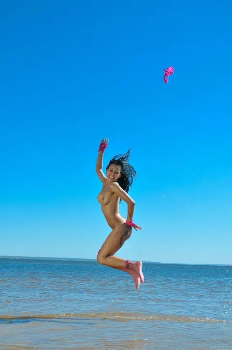 Slim Woman in a Bikini Pulls Panties Aside and Spreads on the Beach – photo 20 of 21