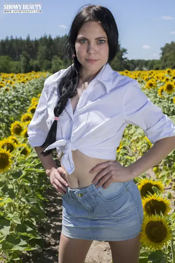 Brunette Lifts Her Skirt and Spreads Her Pussy in a Sunflower Field