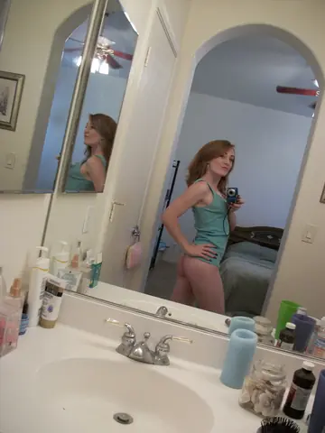 Petite Redhead Fingers Her Pussy in a Mirror Selfie