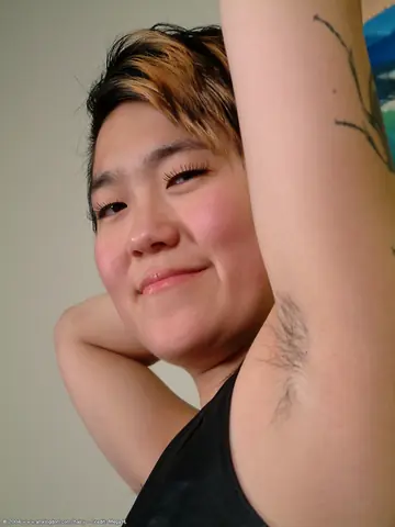 Thick Short-Haired Woman Shows Hairy Armpits and Big Ass