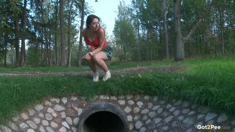 Diana Sweet: Brunette Lifts Her Skirt and Pees Over a Drainage Pipe – photo 3 of 15