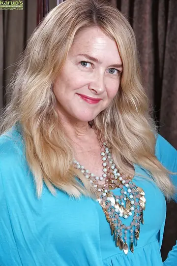 Mature Blonde MILF Lifts Her Skirt and Spreads Her Shaved Pussy