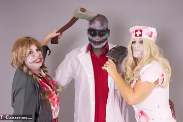 Curvy MILF in a Costume Jerks Off a Black Man in a Threesome