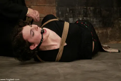 Brunette in a Skirt and Panties Spreads While Hogtied – photo 6 of 15