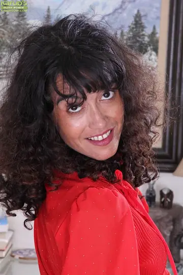 Mature Brunette Undresses and Fingers Her Pussy