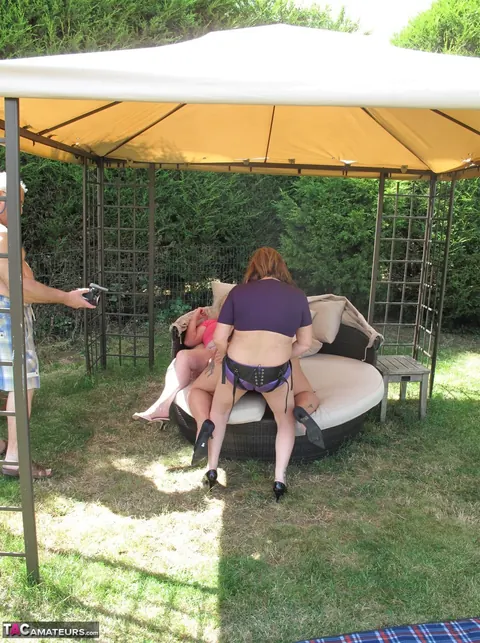 Three Curvy Mature Women Share a Strap-On in the Garden – photo 5 of 16